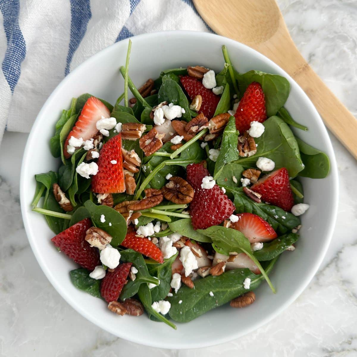 Bowl of strawberry spinach salad. 