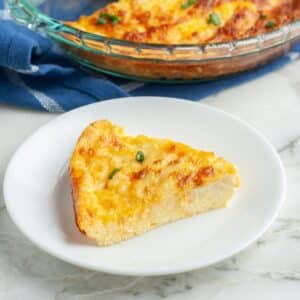 Slice of cheese pie on a plate.