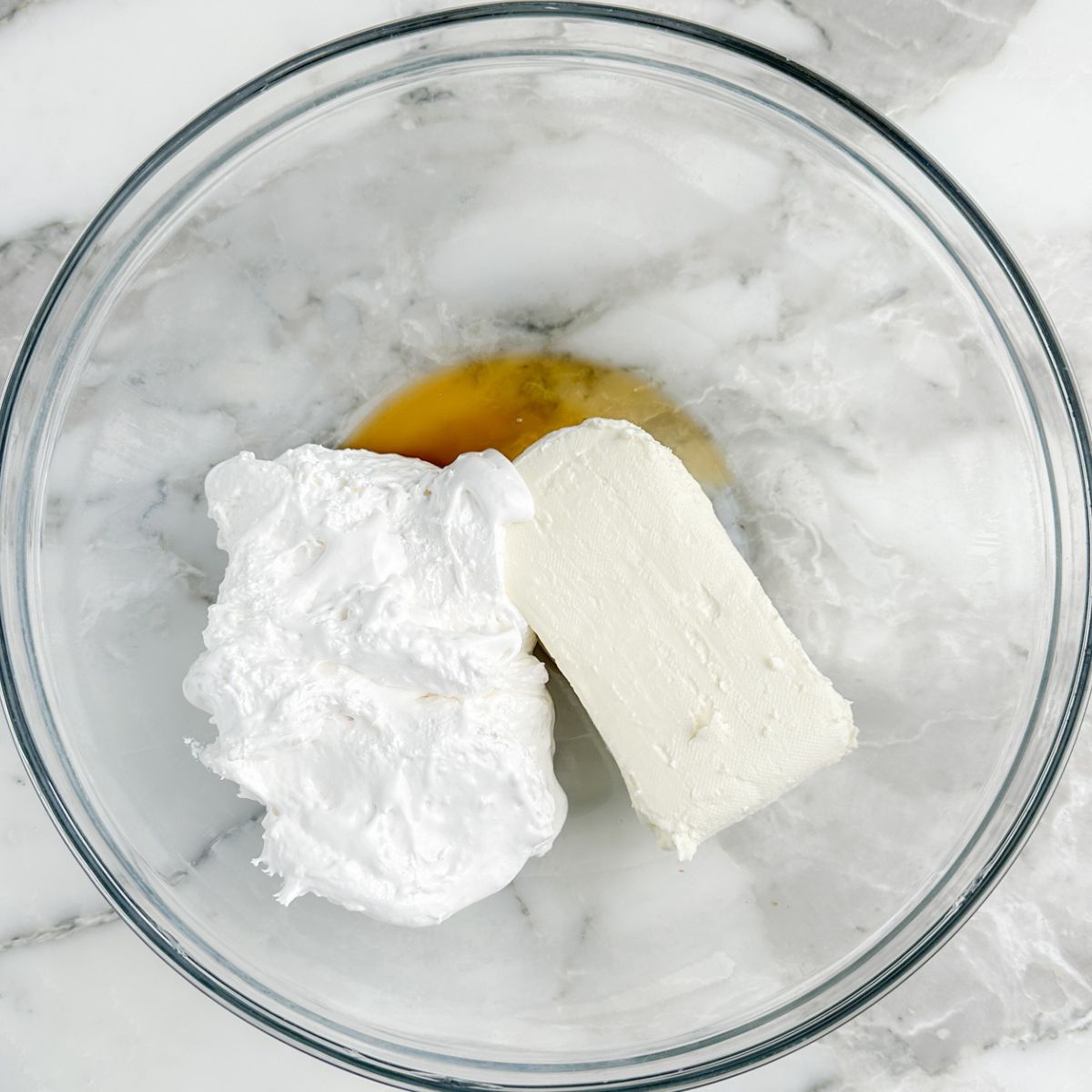 Bowl with cream cheese, marshmallow fluff, and vanilla.