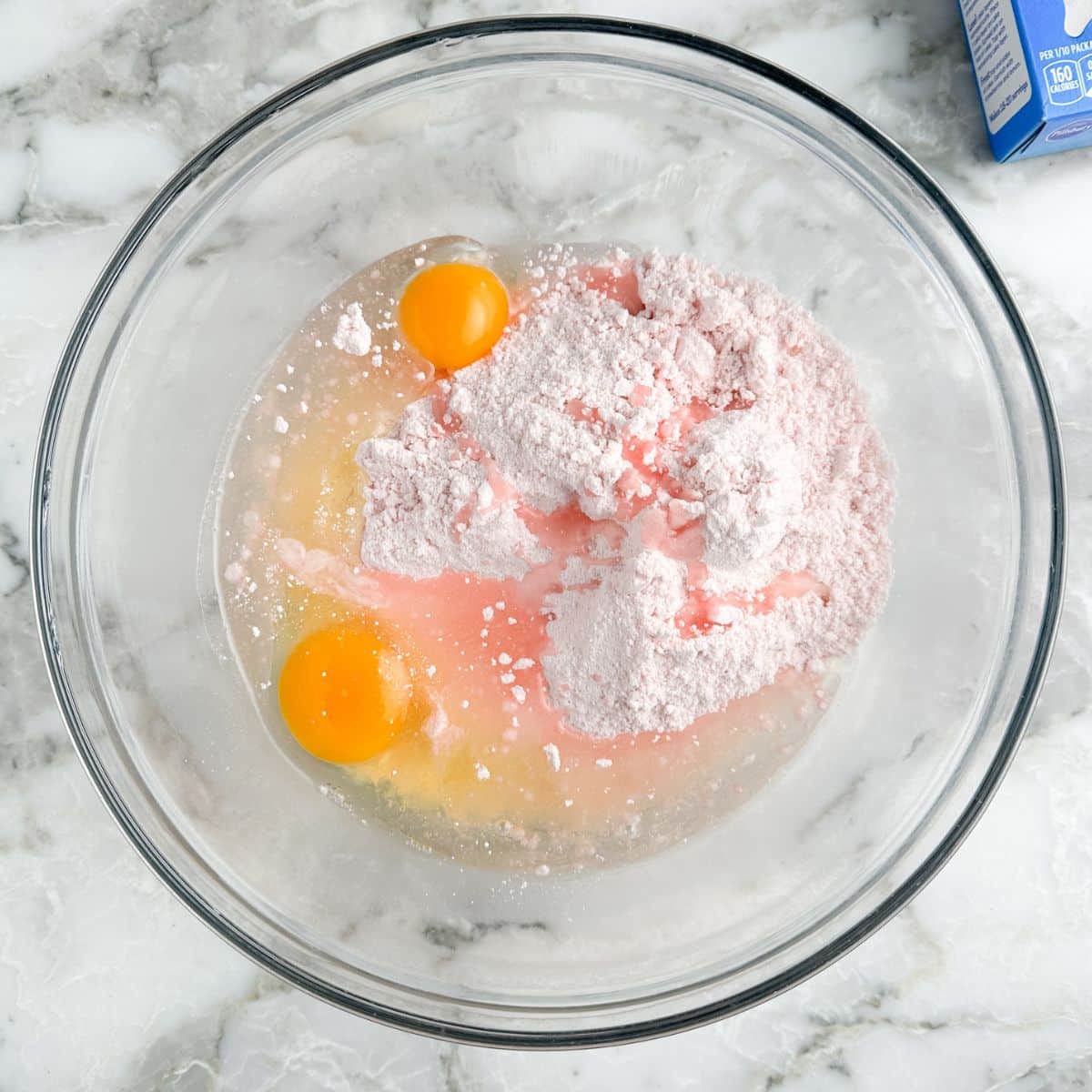 Bowl of cake mix, eggs, and oil. 