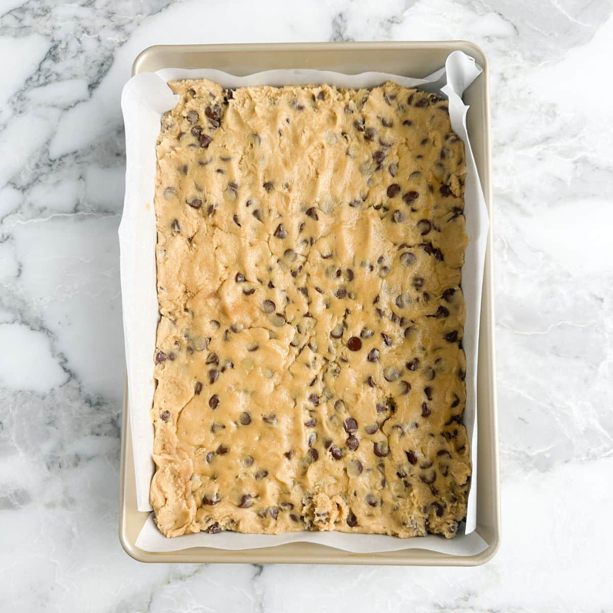 Cookie dough in a baking pan. 