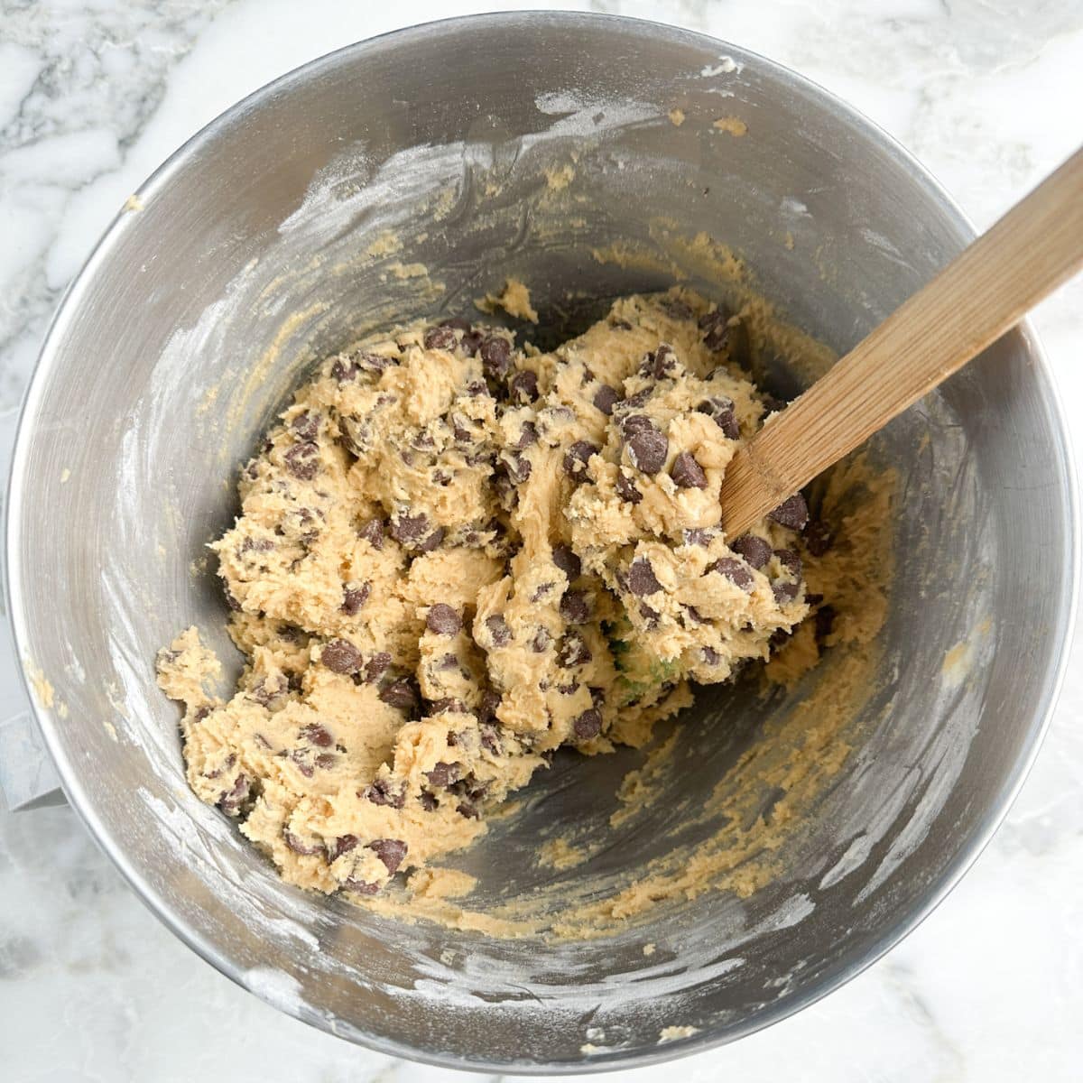 Mixing bowl with chocolate chip cookie dough. 