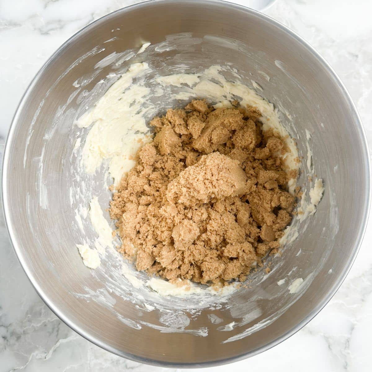 Mixing bowl with butter and brown sugar. 