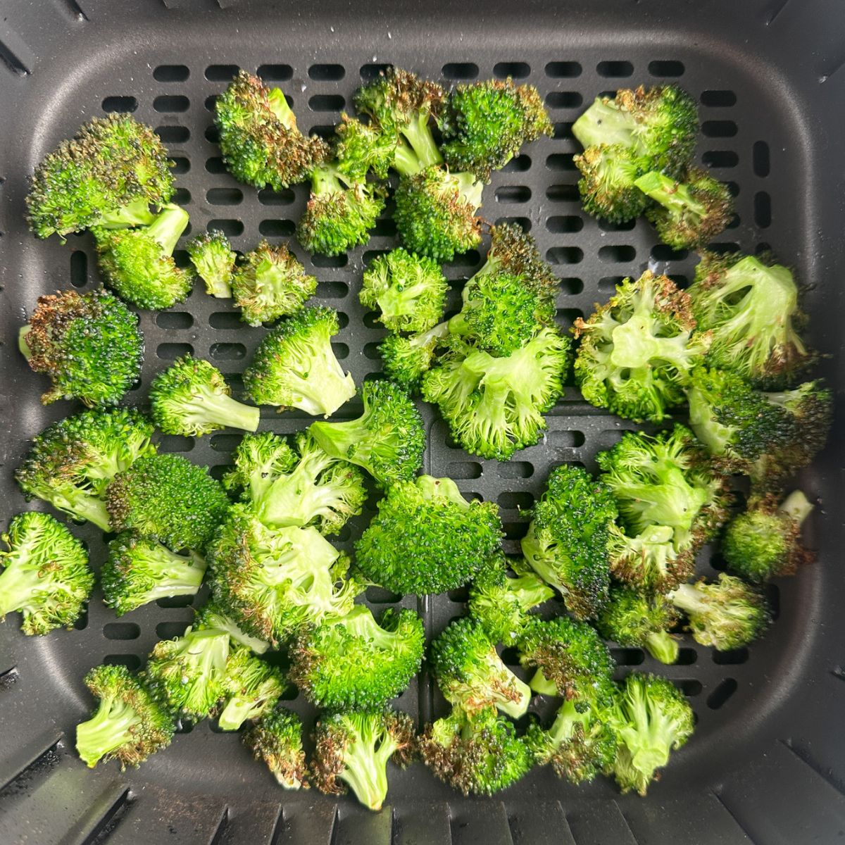 Roasted broccoli in an air fryer. 