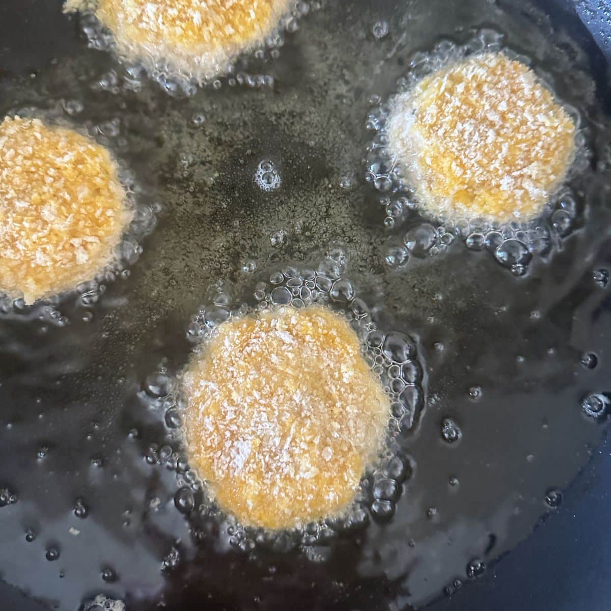 Chicken croquettes in hot oil. 