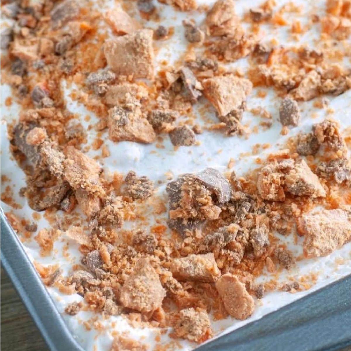 If you love poke cake this Butterfinger version will be at the top of your list! Yellow cake with caramel sauce and of course topped with Butterfingers!