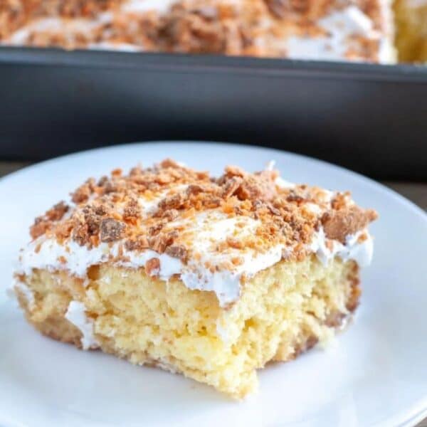 Piece of Butterfinger cake on a plate.