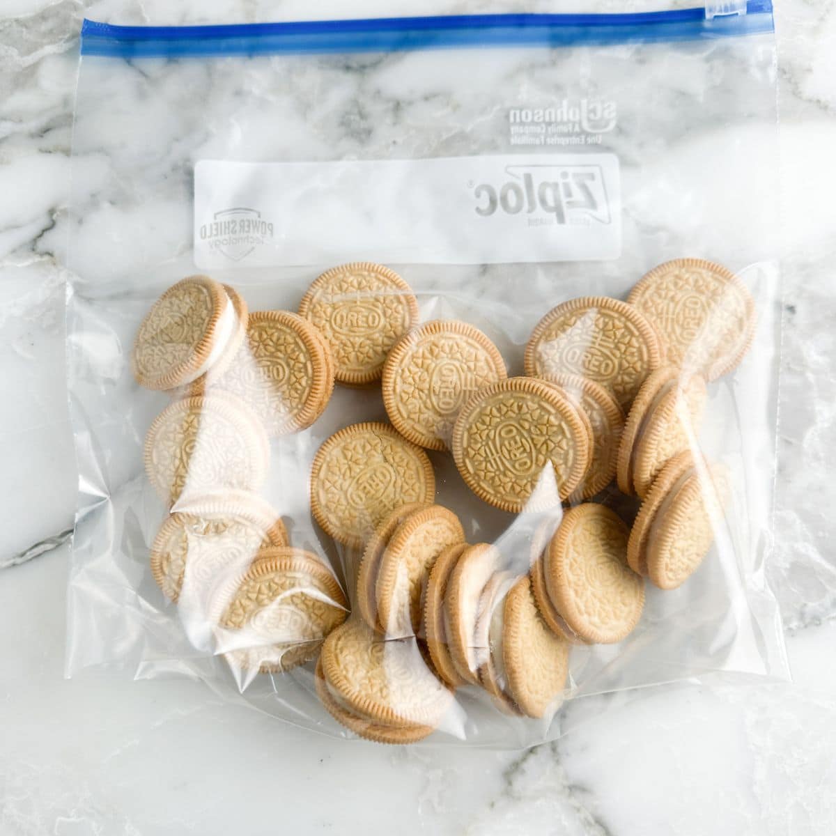Zip top bag filled with Golden Oreo cookies. 
