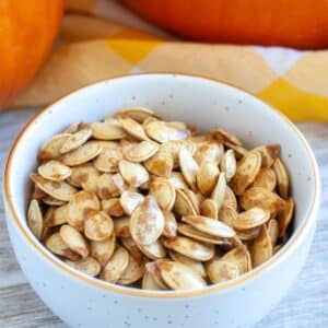 Bowl full or roasted pumpkin seeds.