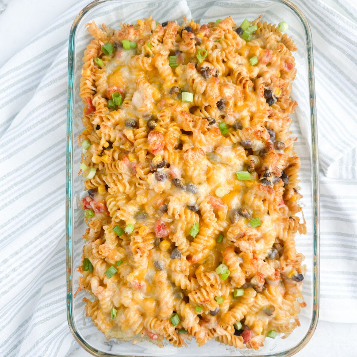 Casserole dish with a chicken and pasta casserole.