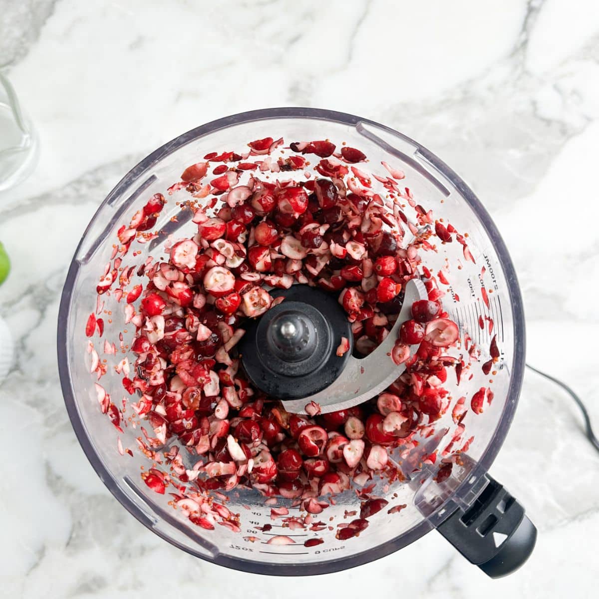 Chopped cranberries in a food processor. 