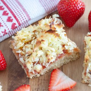 A strawberry bar square with a strawberry beside it