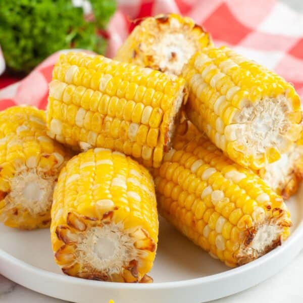 Plate of roasted corn on the cob.
