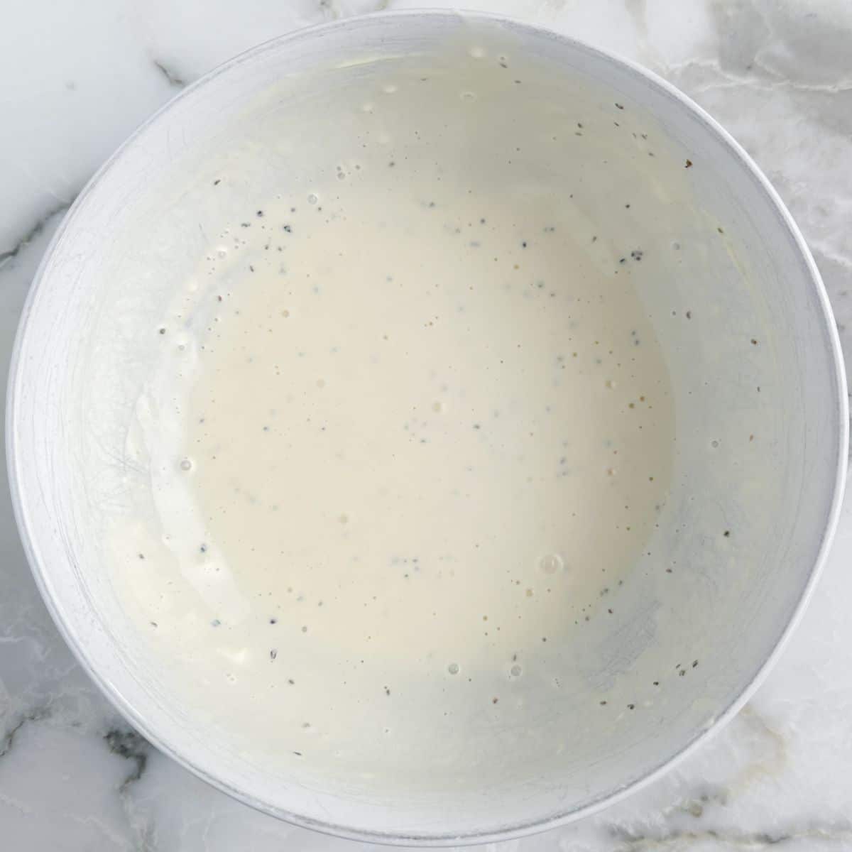 Bowl with a mayonnaise based dressing. 