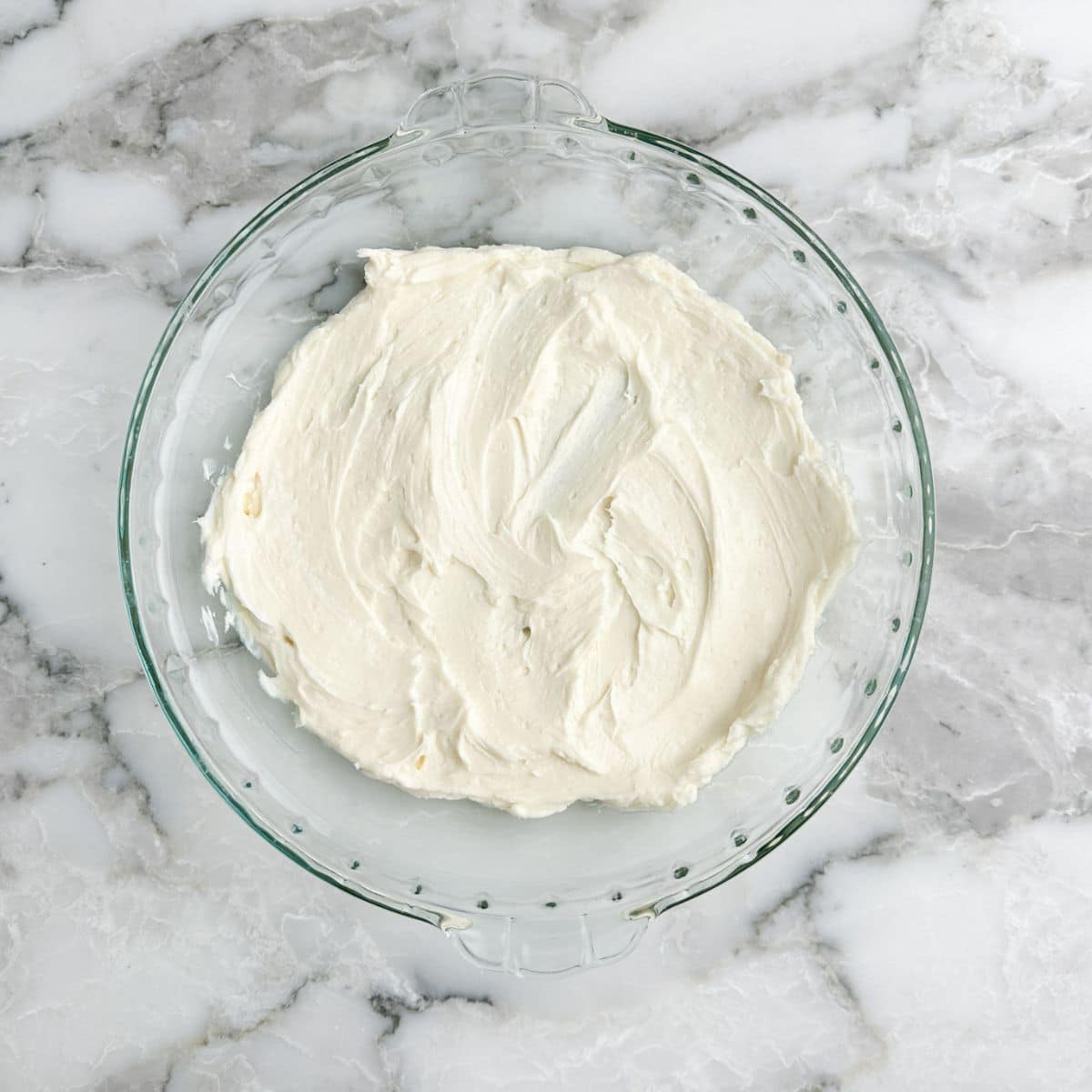 Pie dish with cream cheese mixture.