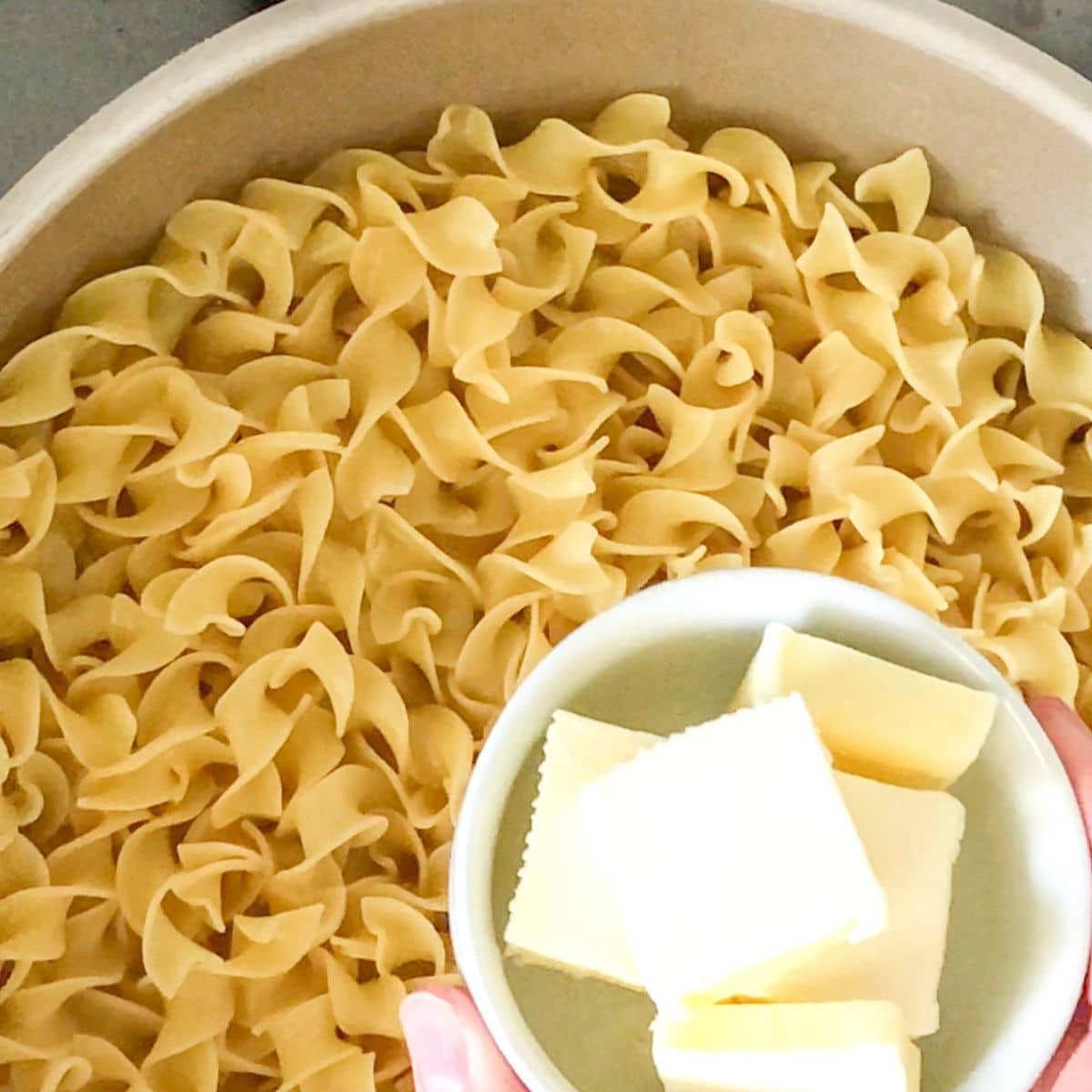 Pot of egg noodles and butter.