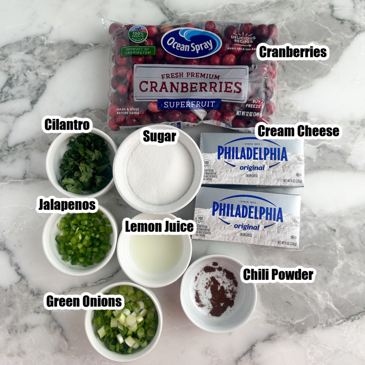 Cranberries, bowl of sugar, cream cheese, cilantro, green onions.