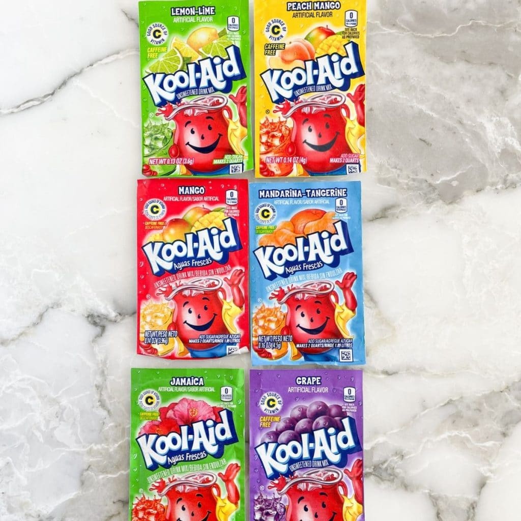 Kool aid packets on a counter. 