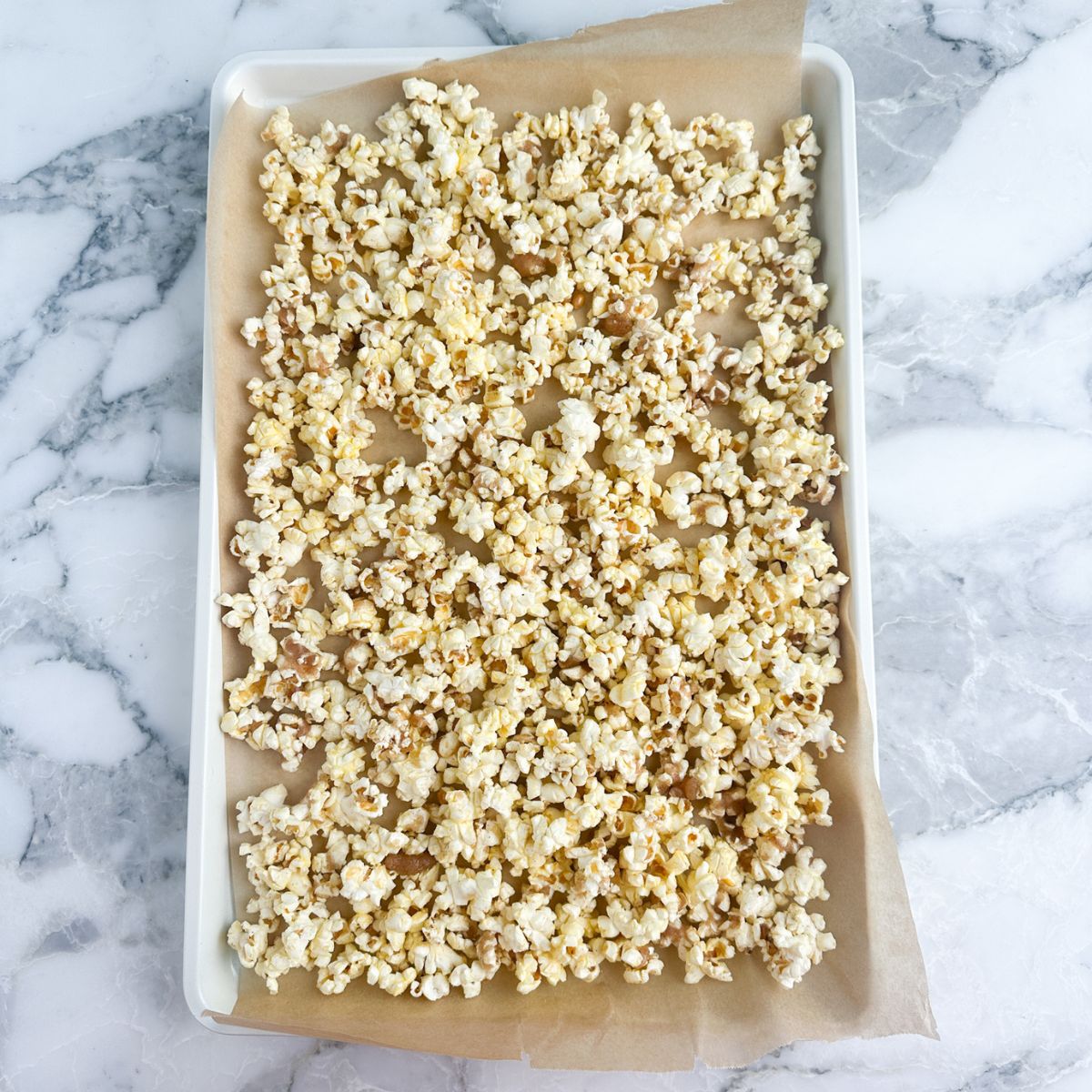 Baking pan with cinnamon sugar popcorn. 