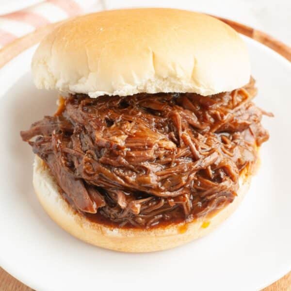 BBQ beef sandwich on a plate.