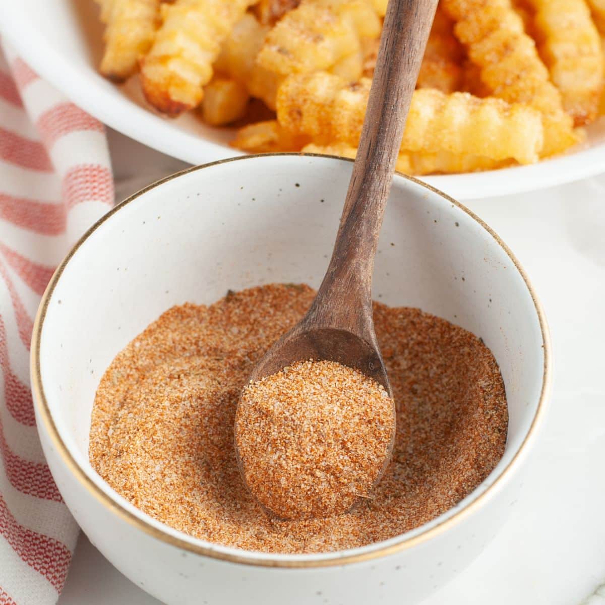 Bowl of seasoning with a small spoon. 