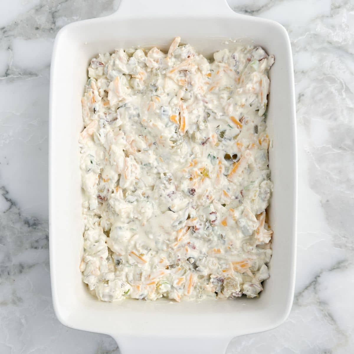 Baking dish with jalapeno pepper dip. 