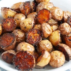 Bowl of seasoned roasted potatoes.