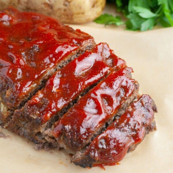 One pound meatloaf topped with sauce.