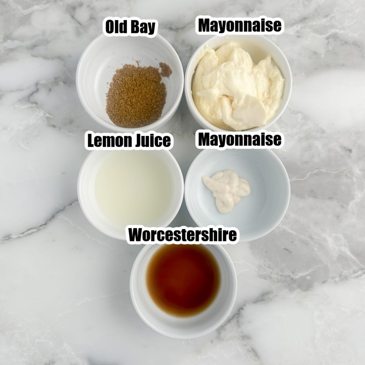 Bowl of mayonnaise, horseradish, Old Bay, and worcestershire. 