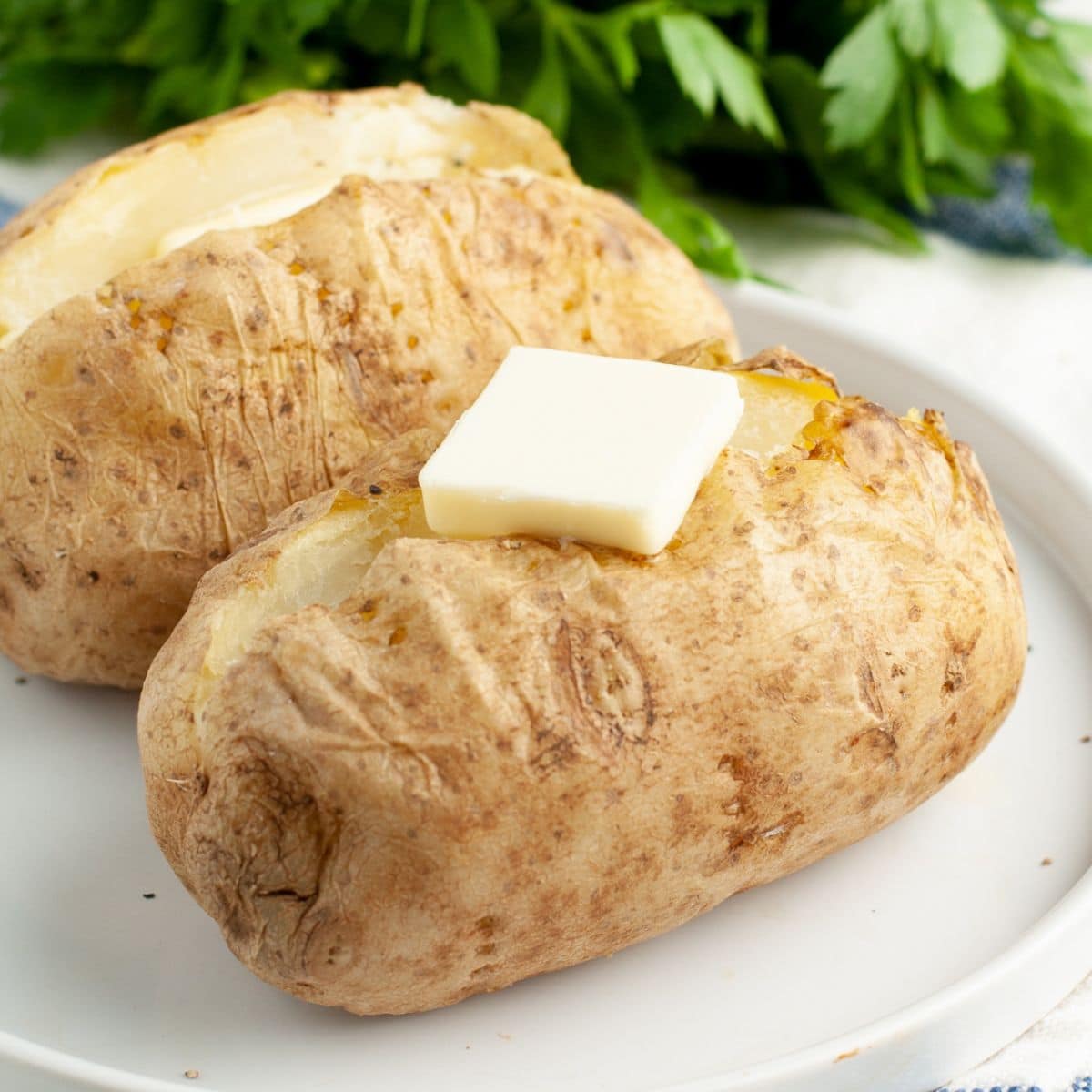 Baked potatoes on a plate.