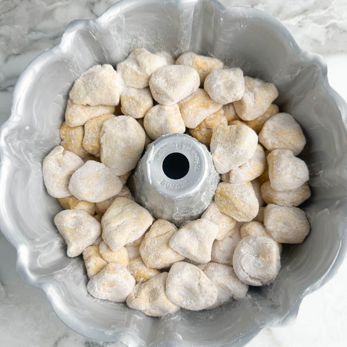 Bundt pan with rolled up dough.