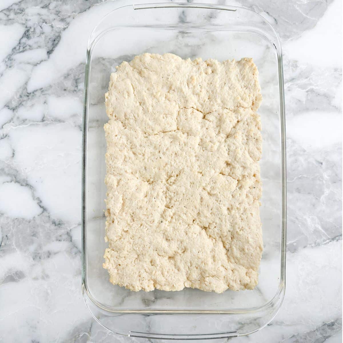 Baked biscuit mix in a casserole dish.