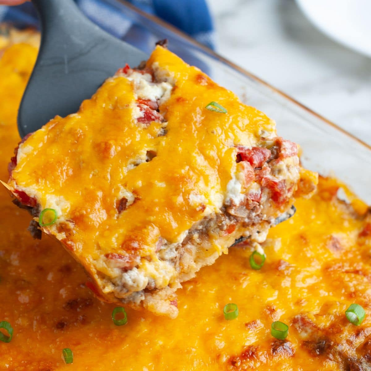 Spatula with piece of hamburger casserole.