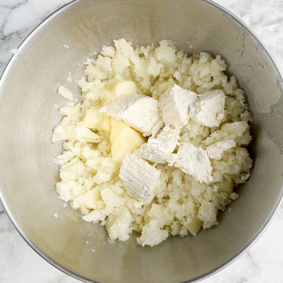 Mashed potatoes with butter and Boursin cheese.