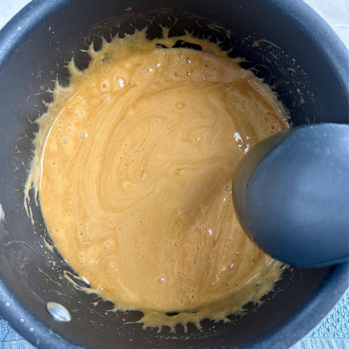 Pot of caramel sauce.