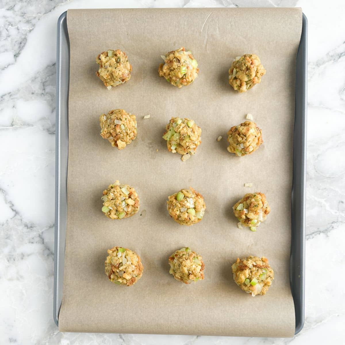 Baking sheet with stuffing balls. 