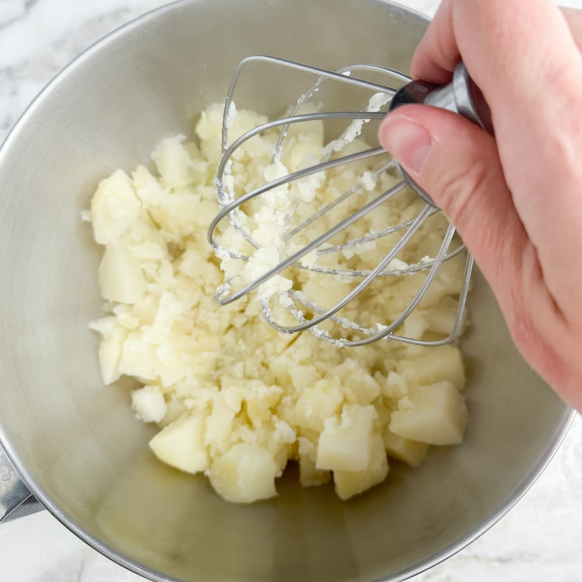 Mashed potatoes with butter and boursin cheese.