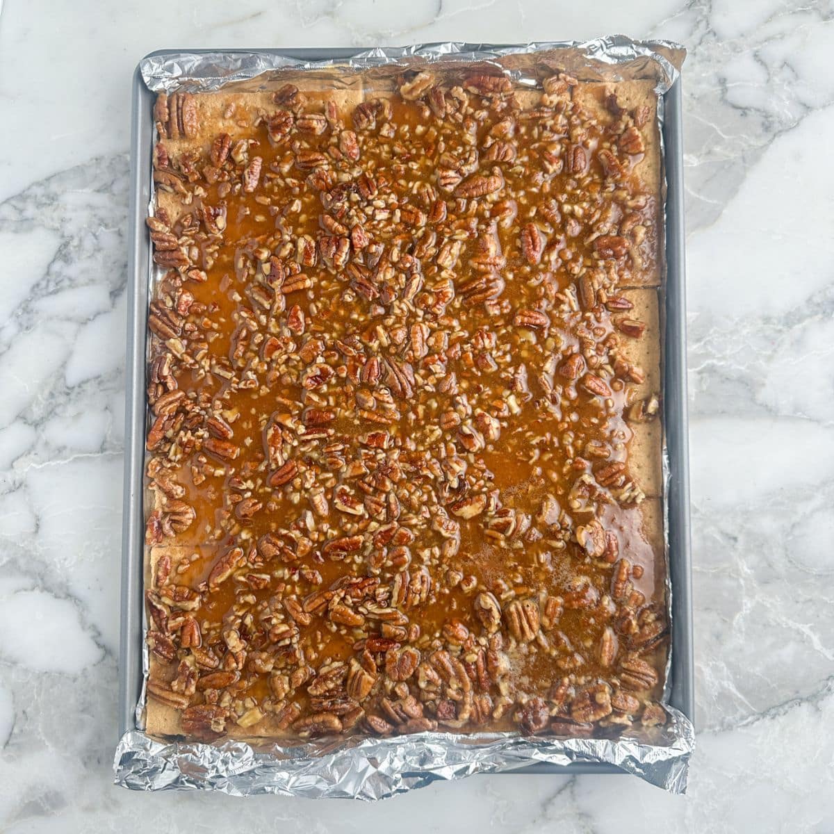 Baking sheet with pecan pie bark. 