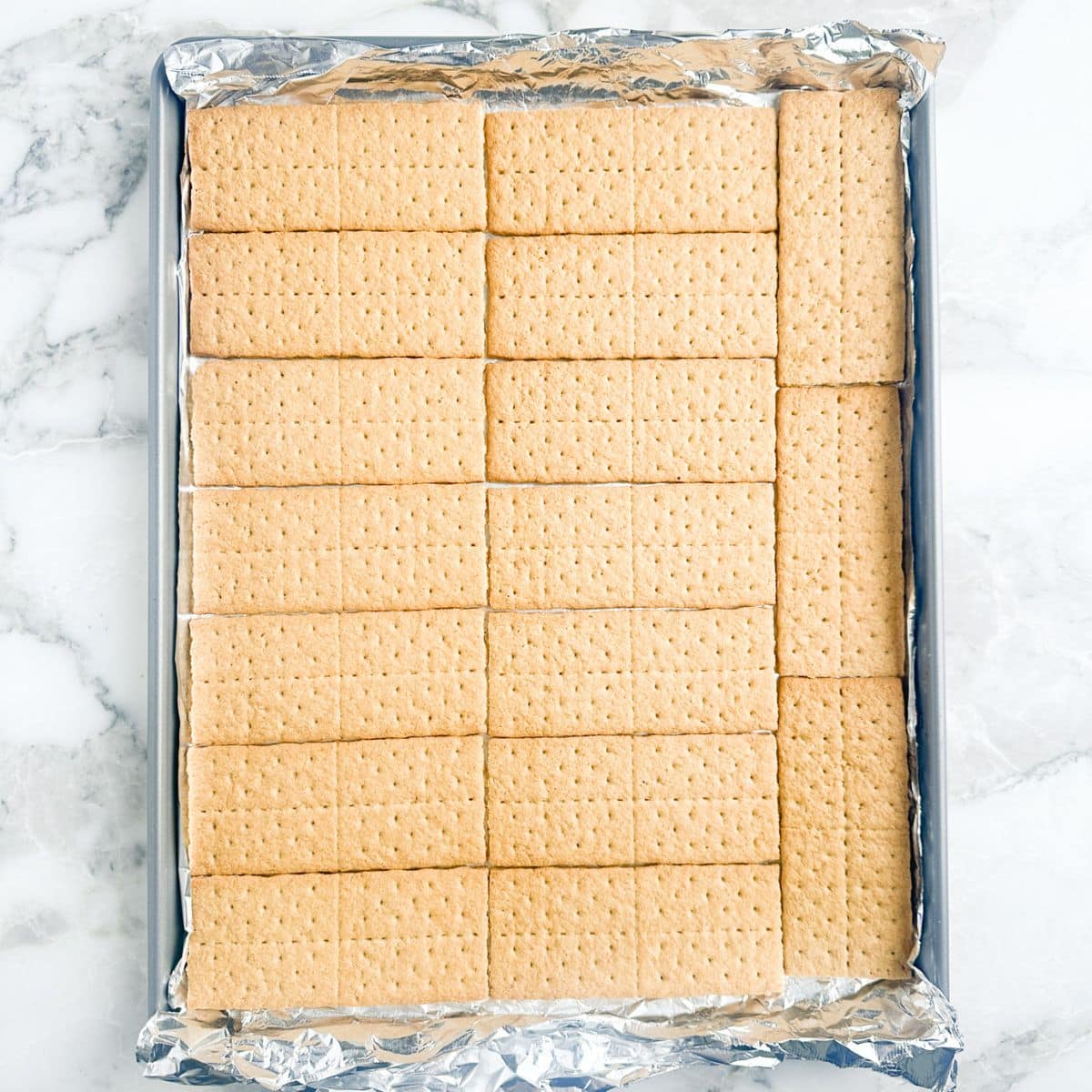 Baking sheet with graham crackers. 