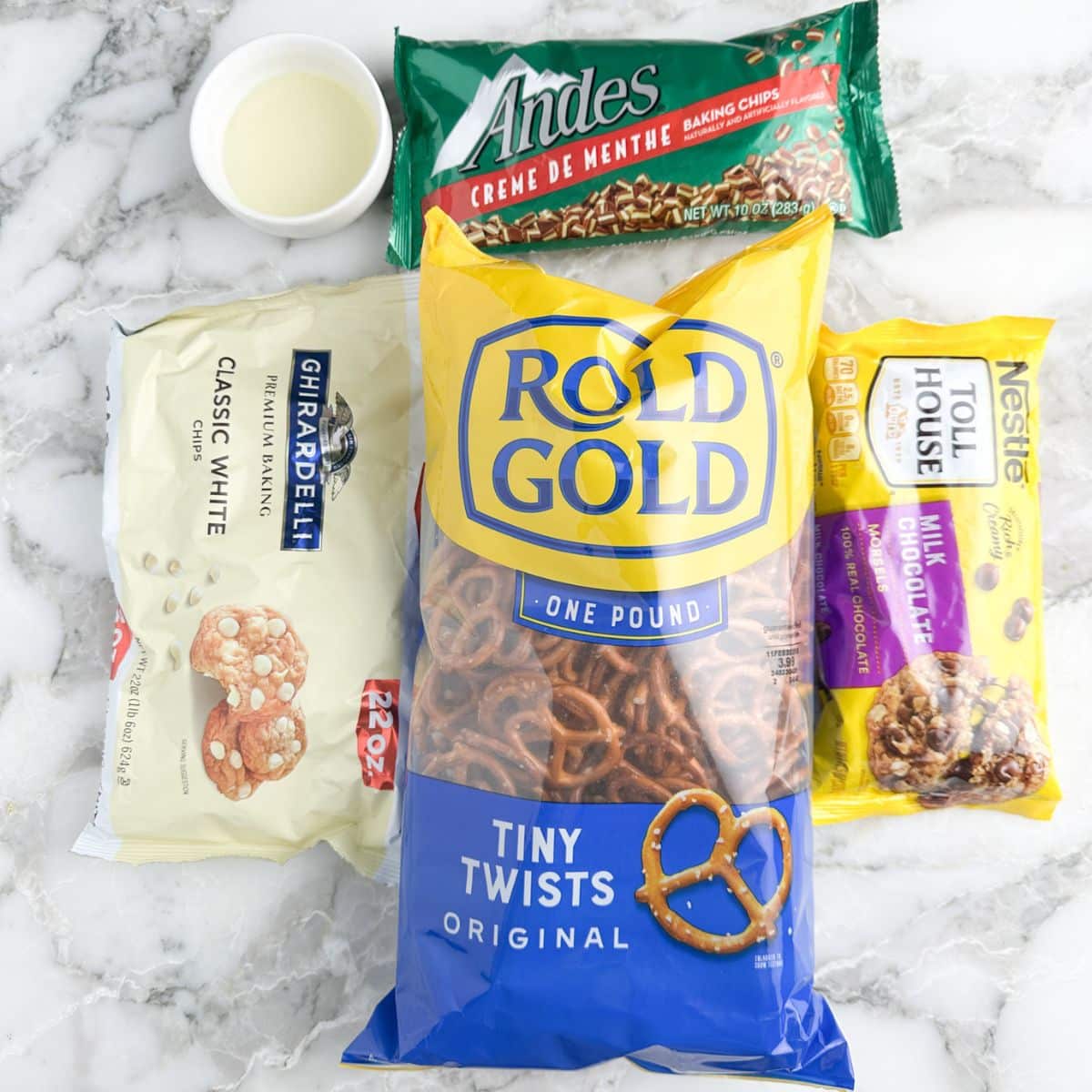 Bag of pretzels, chocolate chips, white chocolate chips, chopped andes mints.