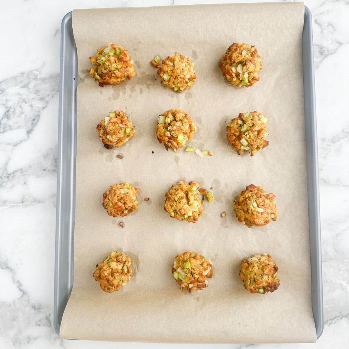 Stuffing balls on a baking sheet. 