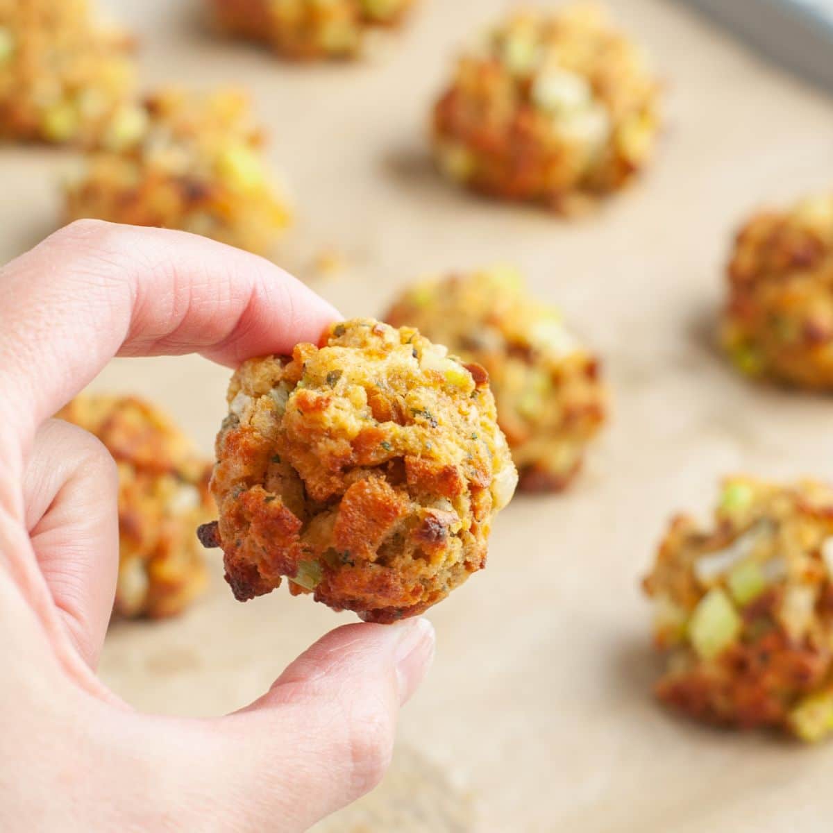 Hand holding stuffing balls.