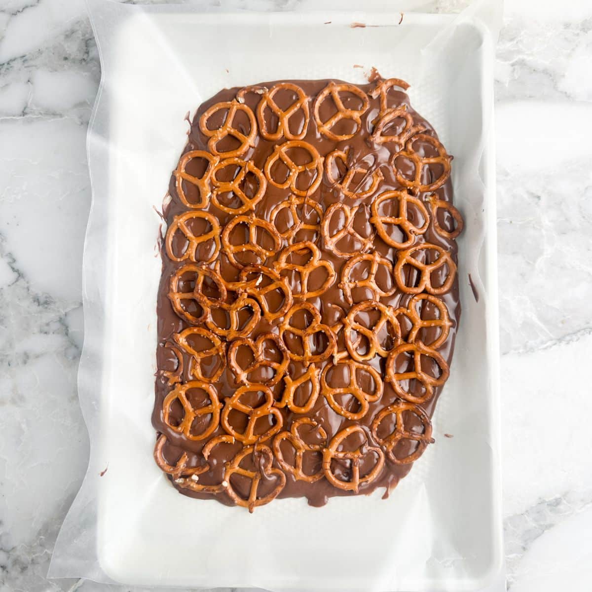 Pretzels on melted chocolate.