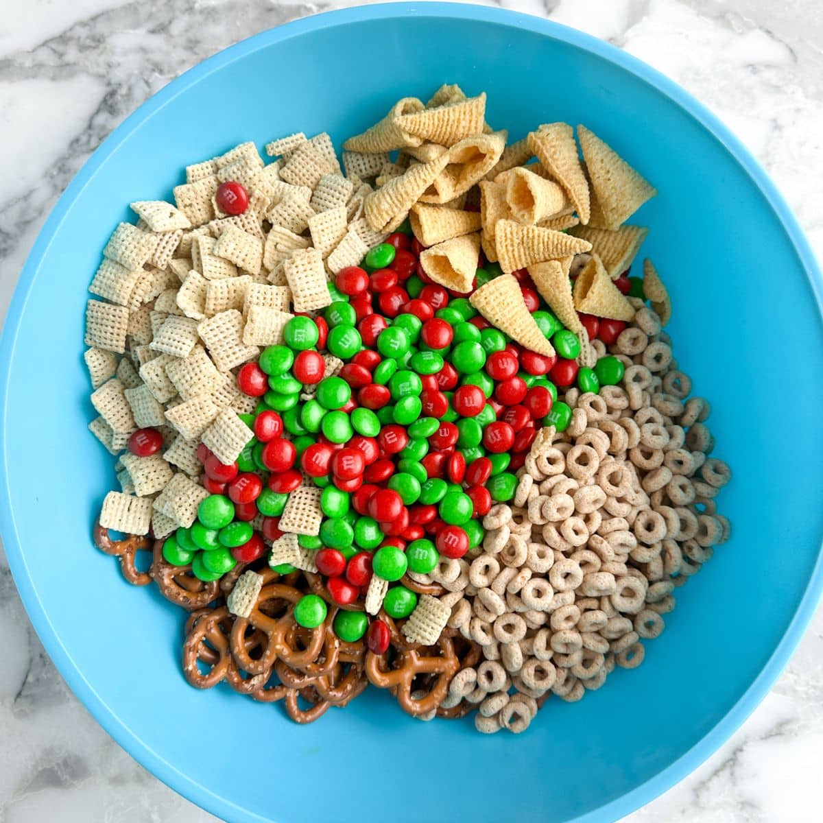 Bowl of cereal, M&M's, pretzels, Bugles chips. 