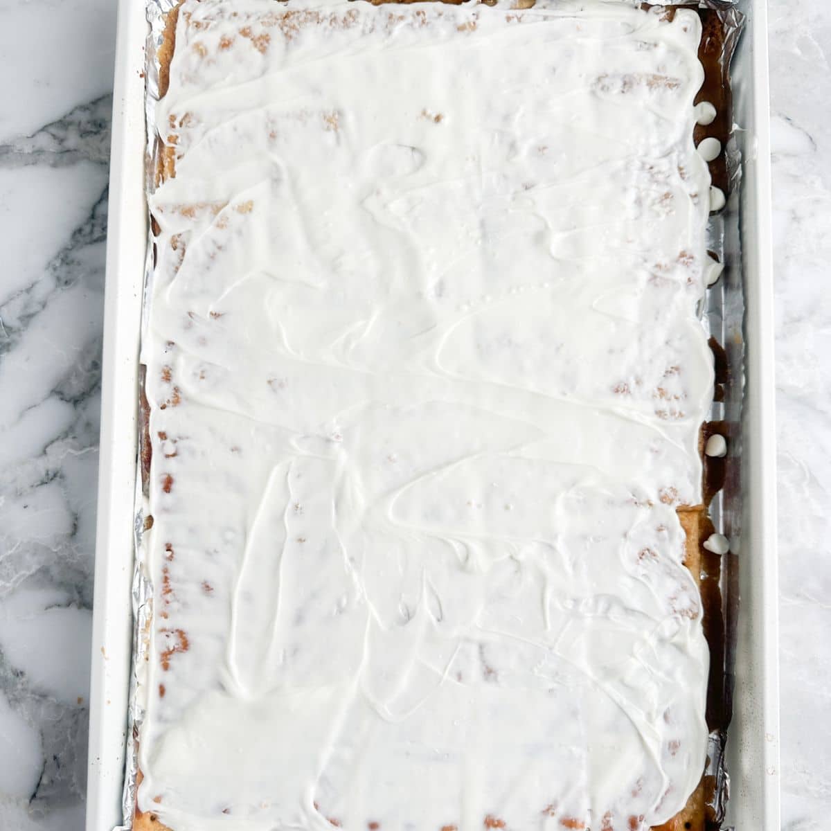 Crackers covered in toffee and melted white chocolate.