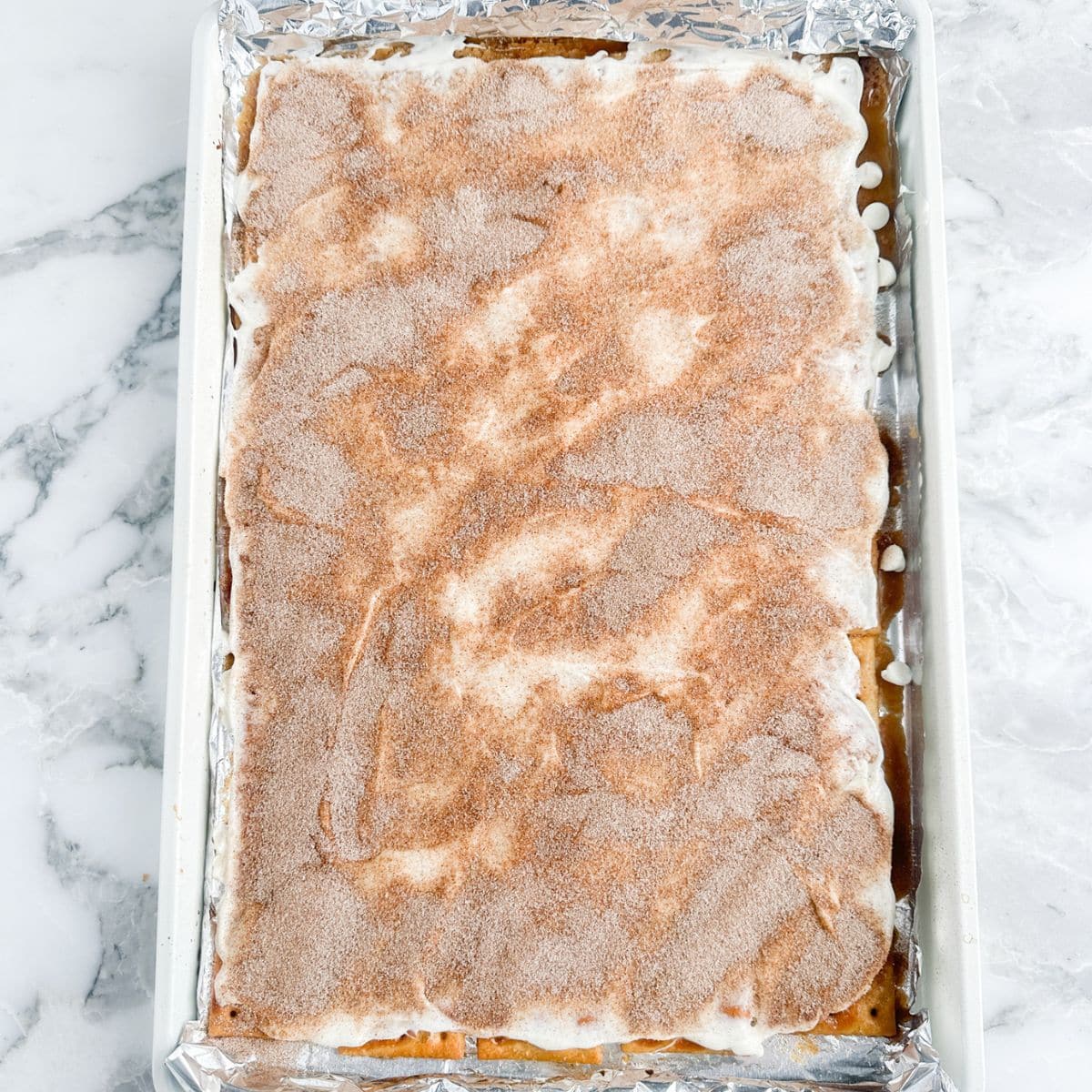 Churro toffee on a baking sheet.