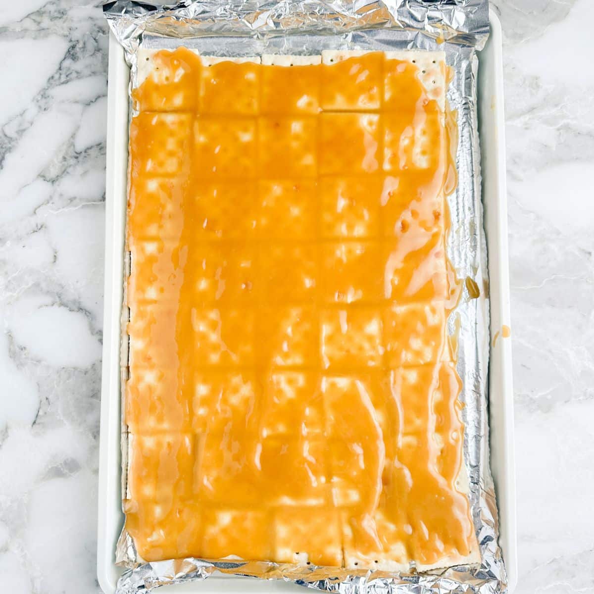 Crackers covered with toffee.