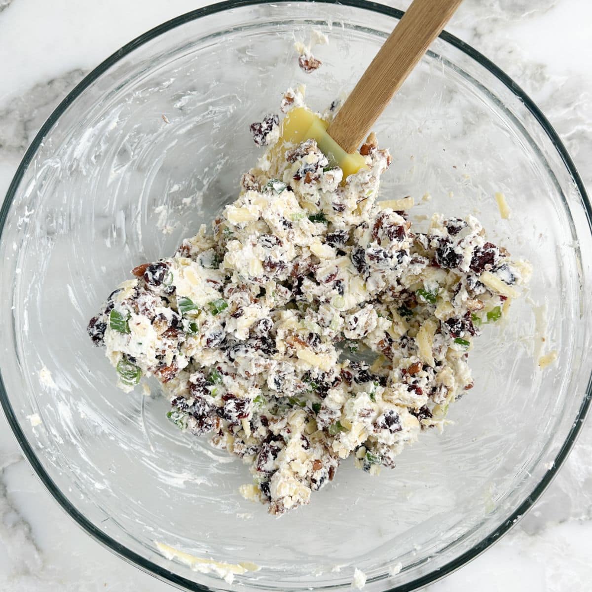 Bowl of cream cheese and cranberry mixture. 