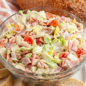 Bowl of hoagie dip with sliced bread.