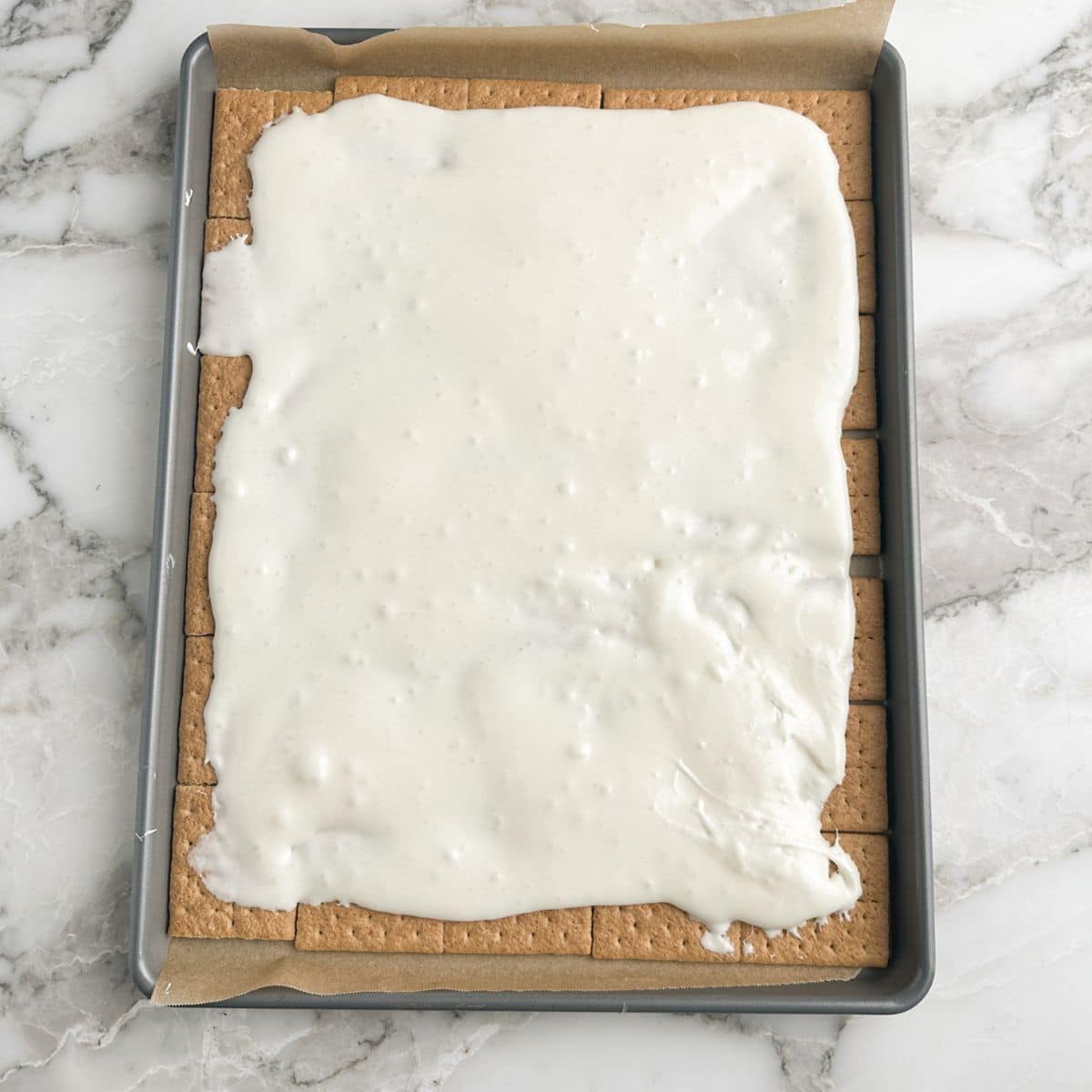 Graham crackers with melted marshmallows over them. 